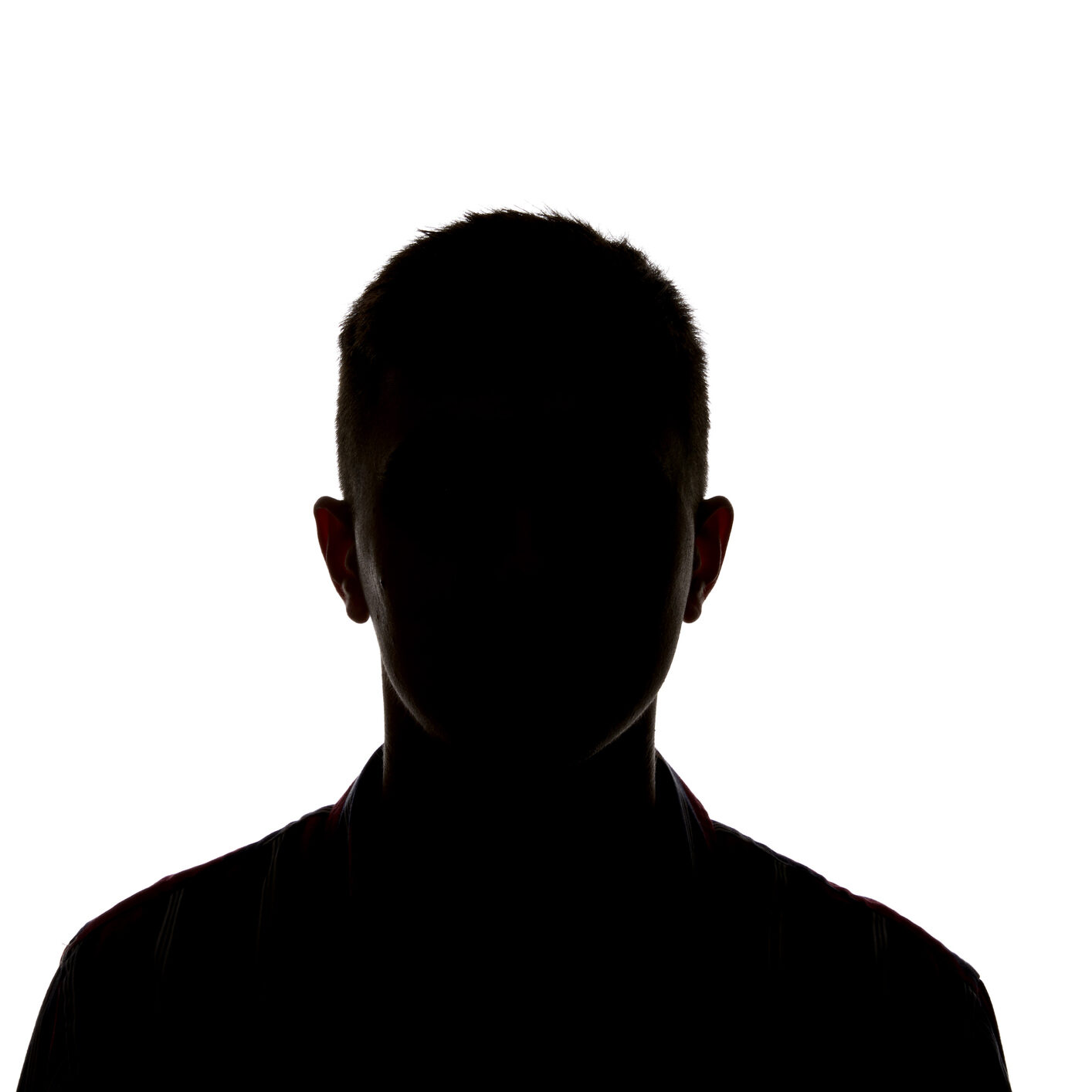 Silhouette of man looking at camera isolated on white